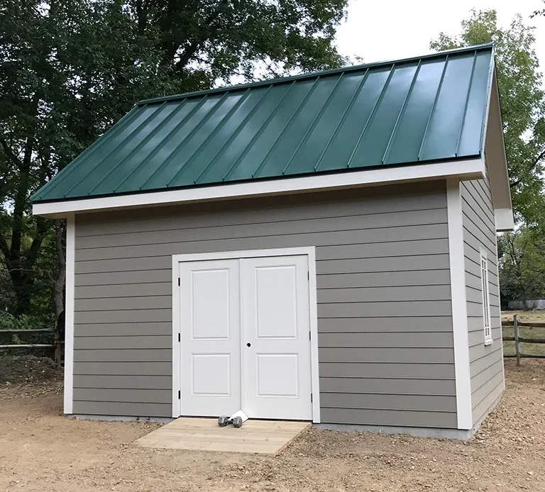 Picture of a shed with an affordable metal roof installed. 